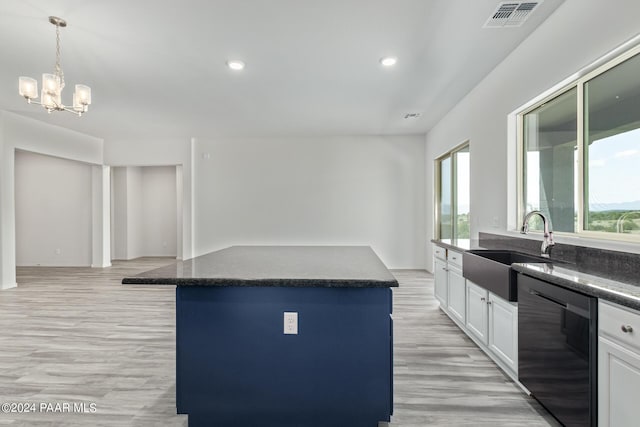 kitchen featuring white cabinets, sink, a notable chandelier, dishwasher, and a kitchen island