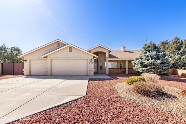 ranch-style house featuring fence, roof with shingles, an attached garage, stucco siding, and concrete driveway