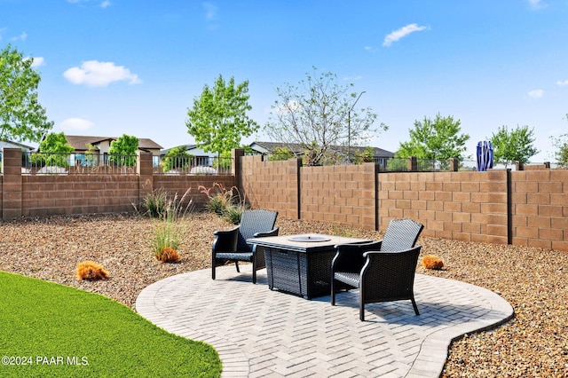 view of patio / terrace featuring a fire pit