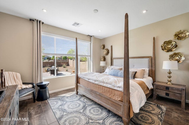 bedroom featuring dark hardwood / wood-style flooring