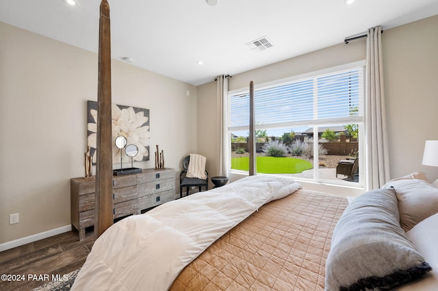 bedroom with hardwood / wood-style flooring