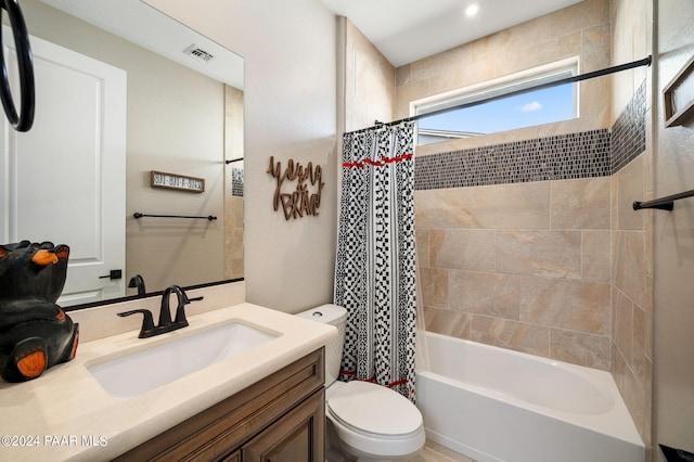 full bathroom with vanity, toilet, and shower / tub combo