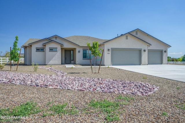 1438 W Anne Marie Dr, Chino Valley, AZ 86323 - ranch-style home with concrete driveway, stucco siding, and a garage