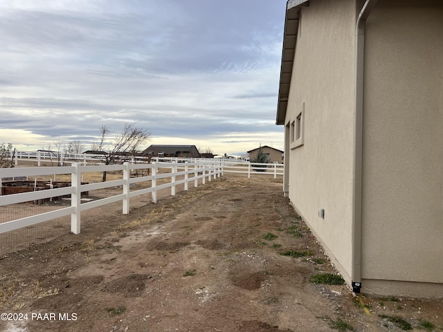 view of yard with a rural view