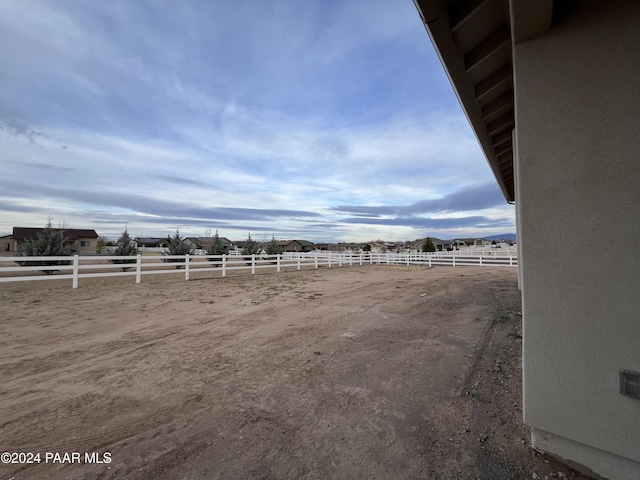 view of yard with a rural view