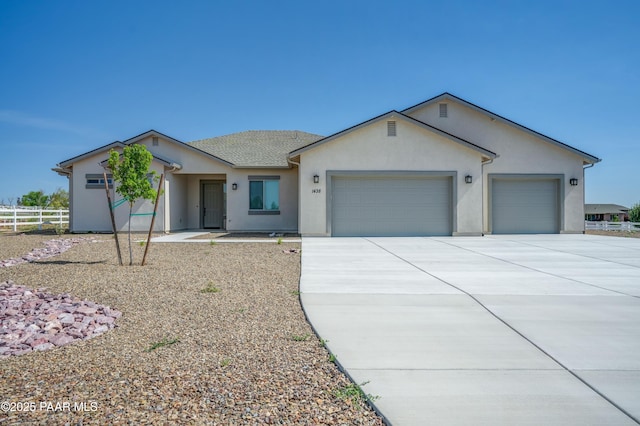 1438 W Anne Marie Dr, Chino Valley, AZ 86323 - ranch-style house featuring an attached garage, concrete driveway, and stucco siding