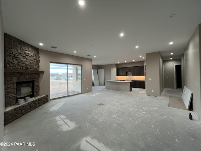 unfurnished living room featuring a fireplace