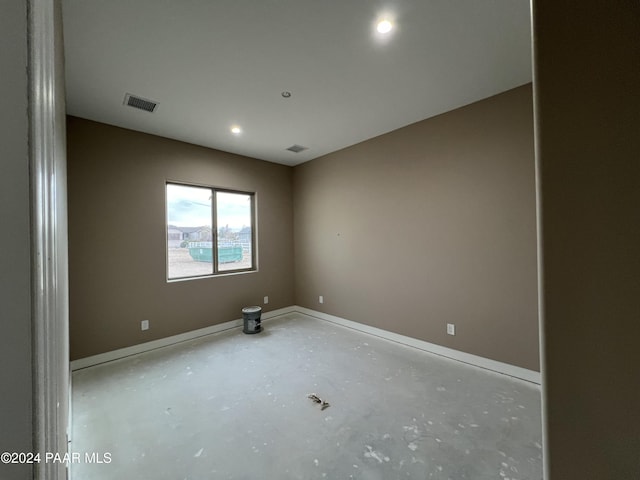 spare room featuring concrete floors