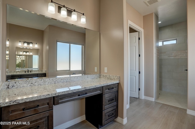 1438 W Anne Marie Dr, Chino Valley, AZ 86323 - bathroom with a walk in shower, vanity, and wood finished floors