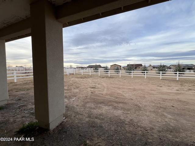 view of yard with a rural view