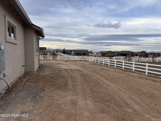 view of yard with a rural view