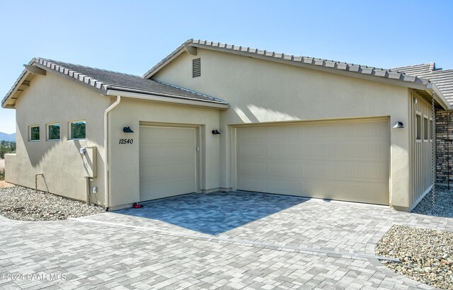 exterior space with decorative driveway