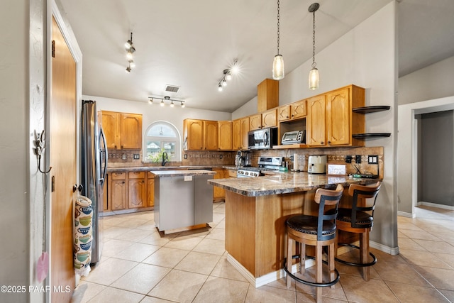 kitchen featuring lofted ceiling, light tile patterned floors, appliances with stainless steel finishes, a peninsula, and open shelves