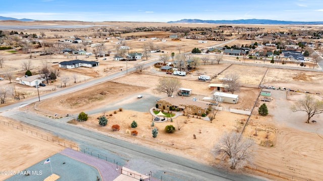 aerial view with view of desert, a rural view, and a mountain view