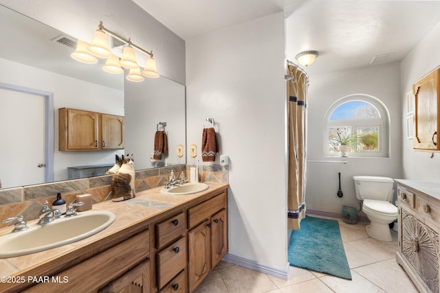 full bath with a sink, visible vents, toilet, and tile patterned floors