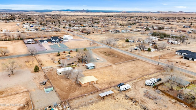 drone / aerial view with view of desert and a mountain view