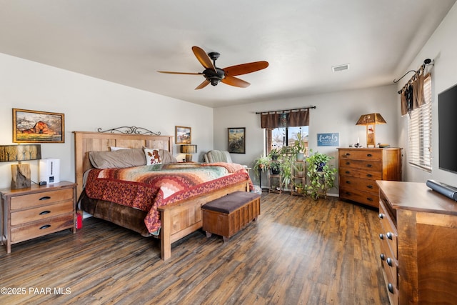 bedroom with visible vents, a ceiling fan, and wood finished floors