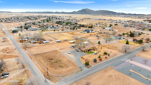 birds eye view of property featuring a mountain view and a desert view