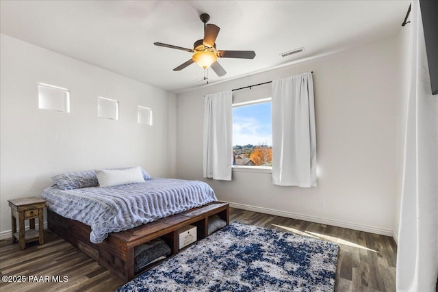 bedroom featuring ceiling fan and dark hardwood / wood-style flooring