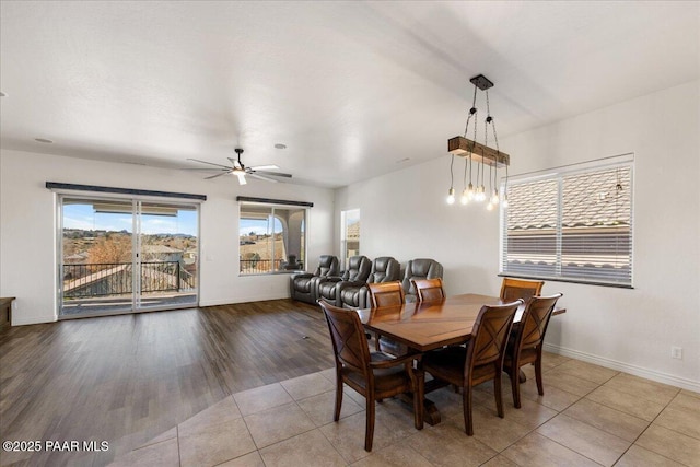 tiled dining area with ceiling fan