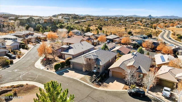 birds eye view of property featuring a mountain view