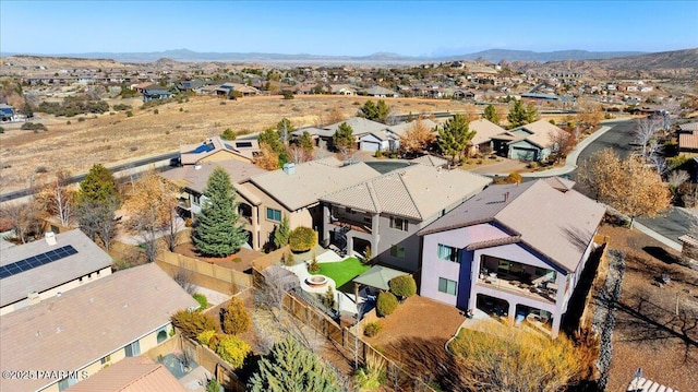 birds eye view of property with a mountain view