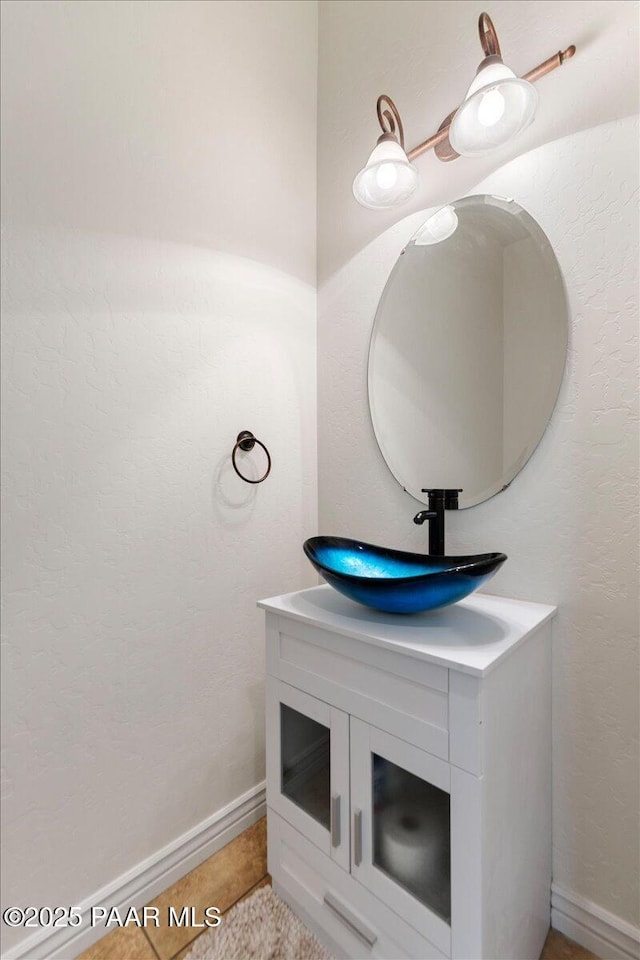 bathroom featuring tile patterned flooring and vanity