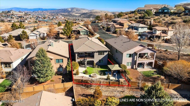 birds eye view of property featuring a mountain view