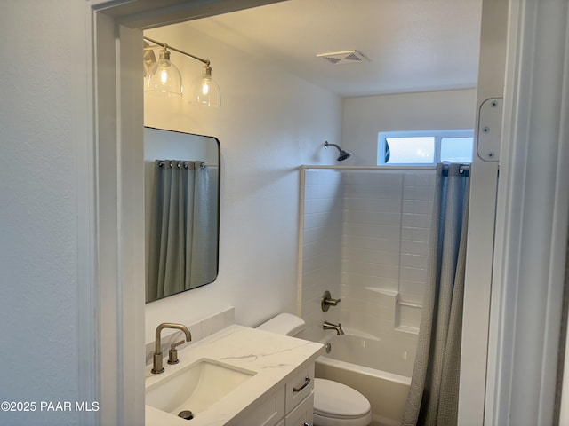 full bathroom featuring vanity, shower / tub combo with curtain, and toilet