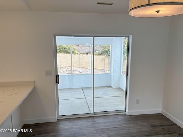 doorway featuring dark hardwood / wood-style flooring