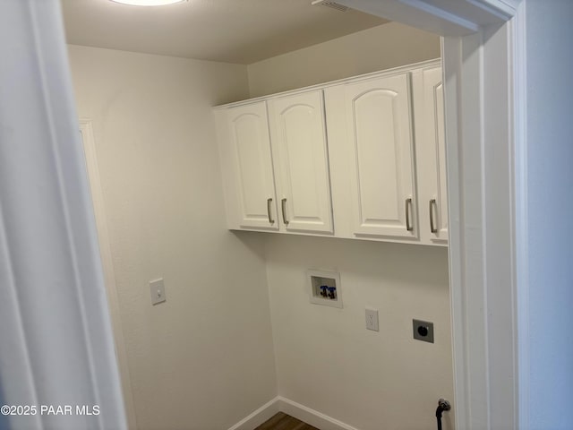 laundry room featuring cabinets, hookup for a washing machine, and hookup for an electric dryer