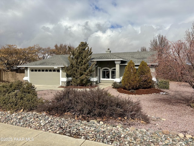 ranch-style home featuring a garage