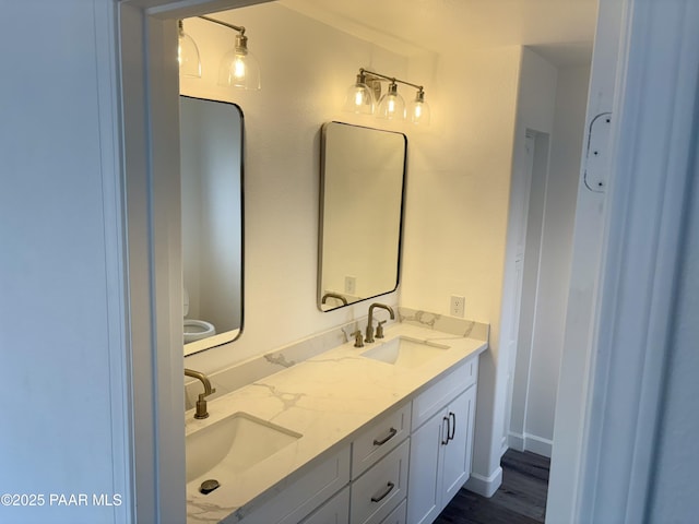 bathroom with vanity and hardwood / wood-style floors