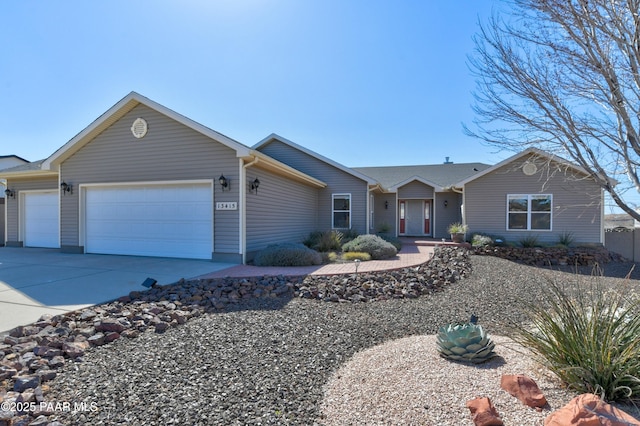 ranch-style home with driveway and an attached garage