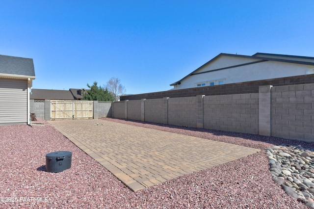 view of yard featuring a fenced backyard and a patio area