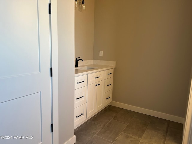 bathroom featuring tile patterned flooring and vanity