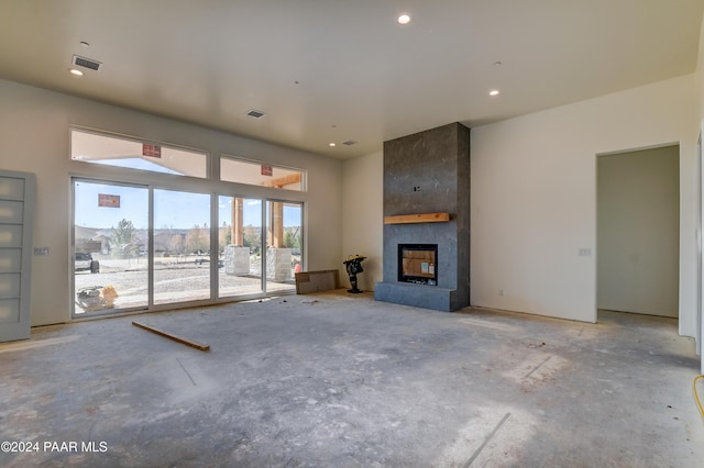 unfurnished living room featuring a fireplace