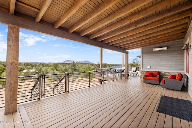 wooden deck with a mountain view