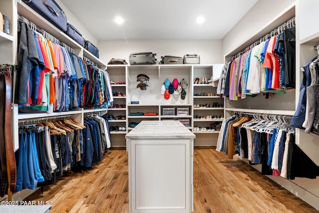 walk in closet featuring light wood finished floors