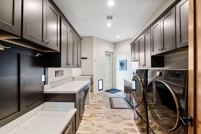 laundry room featuring visible vents, baseboards, recessed lighting, cabinet space, and independent washer and dryer