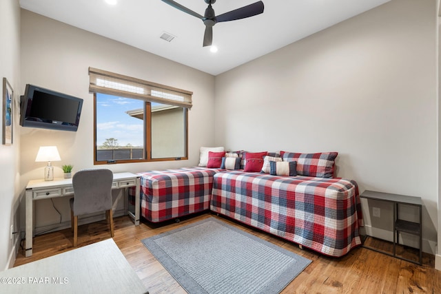 bedroom with visible vents, a ceiling fan, wood finished floors, recessed lighting, and baseboards