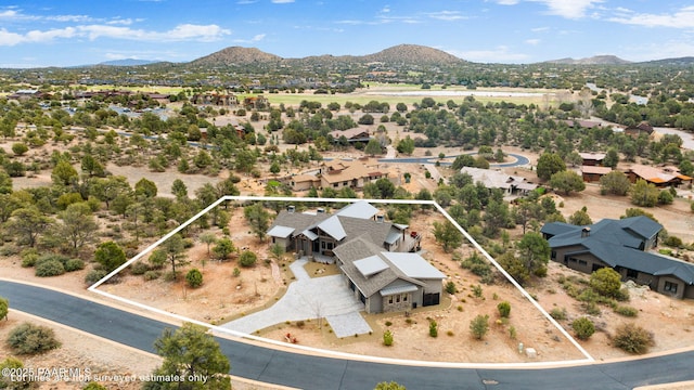 birds eye view of property featuring a mountain view