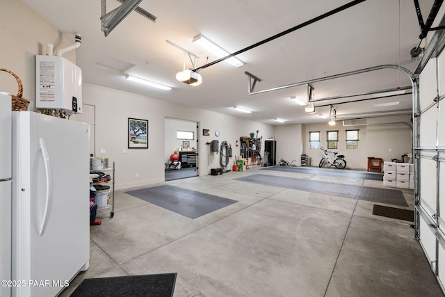 garage featuring water heater, a garage door opener, and freestanding refrigerator