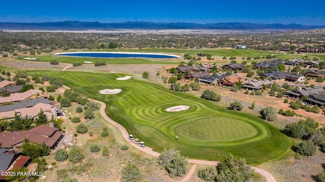 birds eye view of property featuring a mountain view, a residential view, and view of golf course