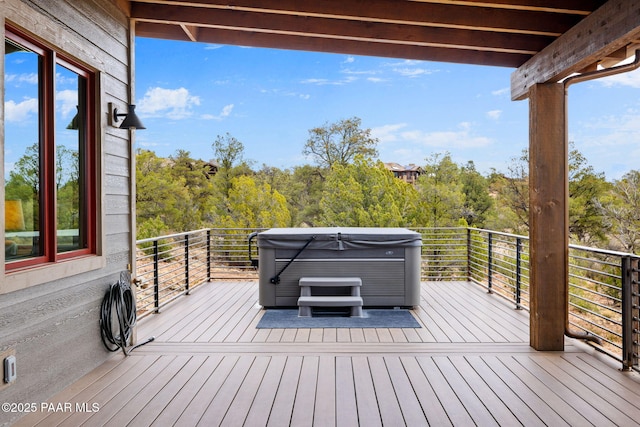 wooden deck with a hot tub