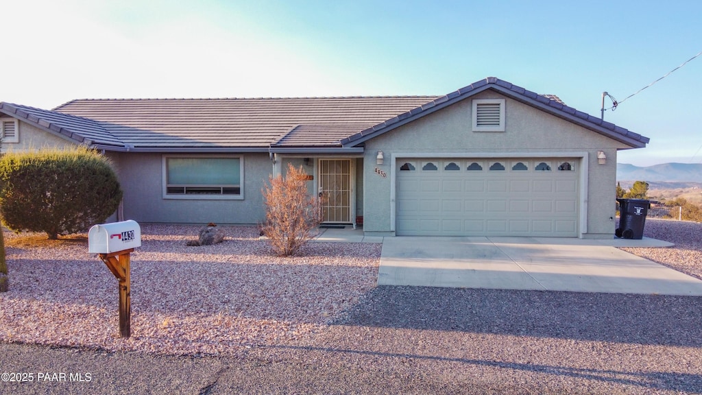 single story home with a garage