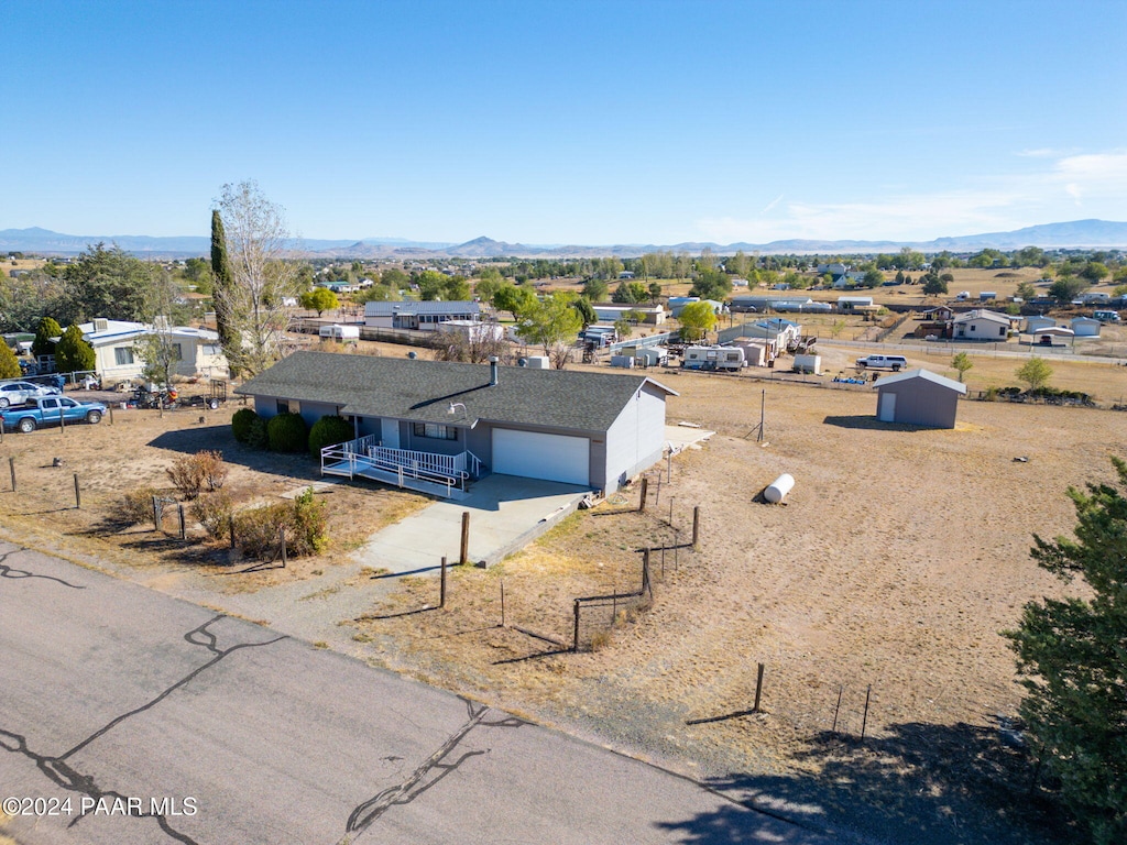 birds eye view of property featuring a mountain view