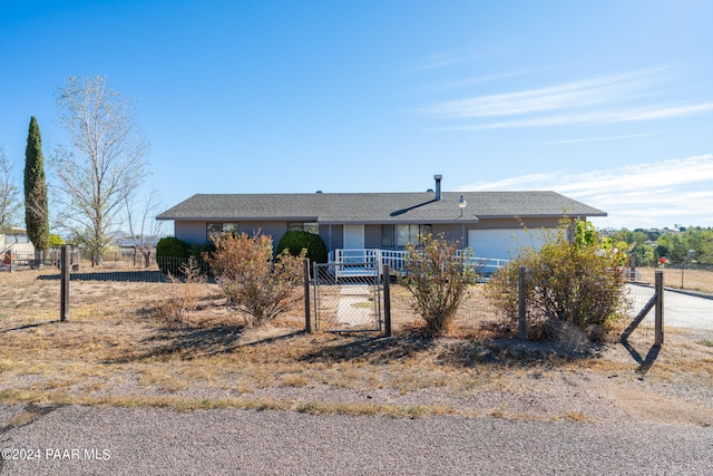 single story home featuring a garage