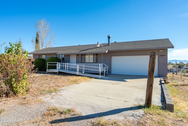 single story home featuring a garage