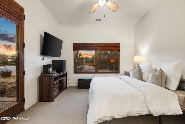 bedroom with ceiling fan, light carpet, and access to outside